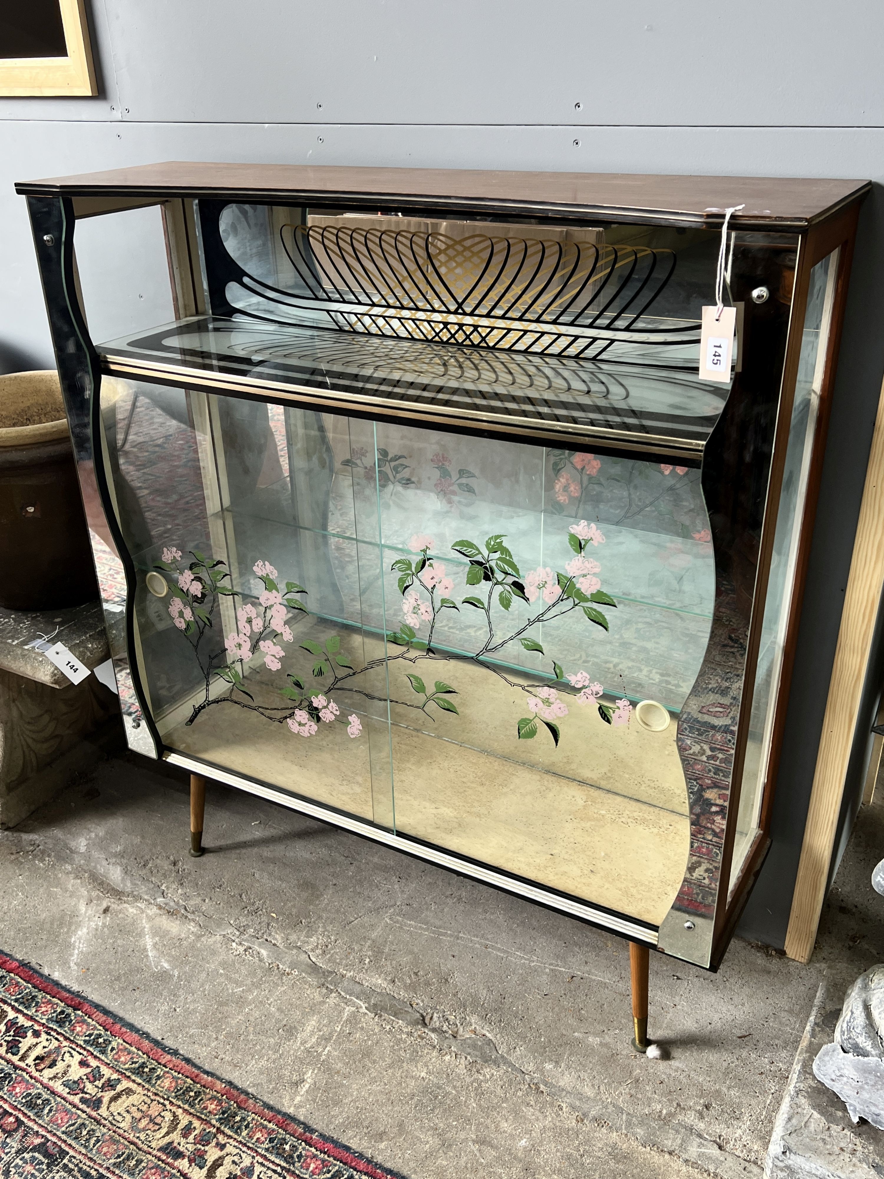 A 1950’s mirrored display cabinet, width 103cm, depth 30cm, height 114cm